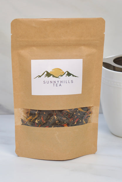 sunny-hills-tea-Organic-Ginger-Orange-Peach-Green-tea-front-of-pack